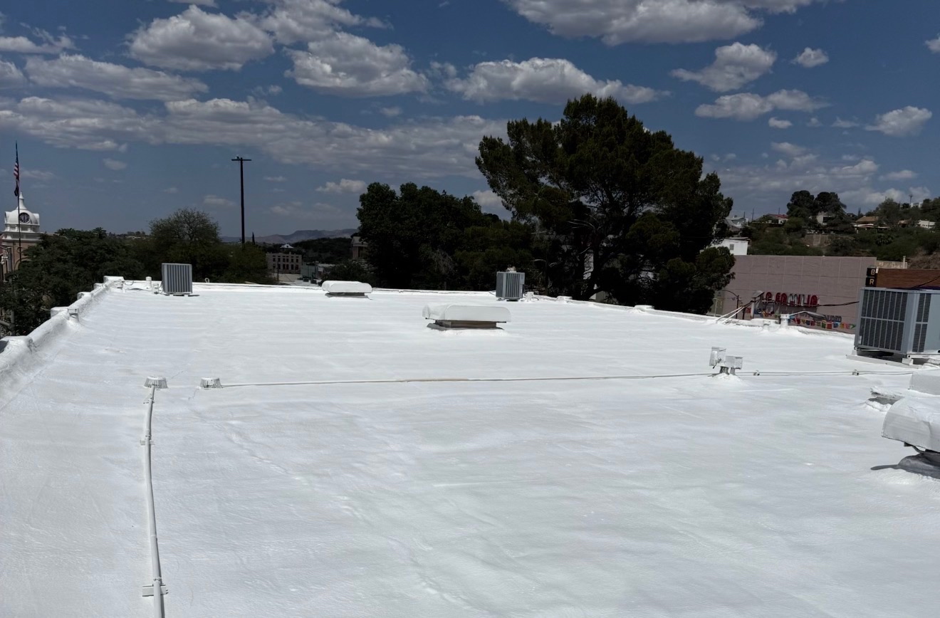 Completed reflective white roof coating project by W&D Roofing