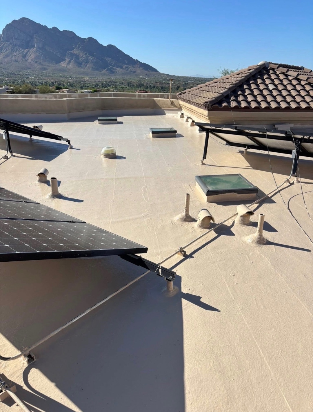After W&D Roofing silicone roof coating restoration with reflective waterproof membrane