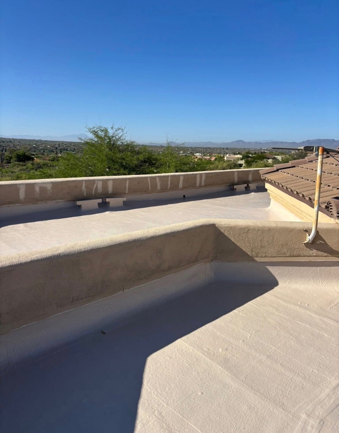 After W&D Roofing waterproof roof coating system with reflective silicone coating