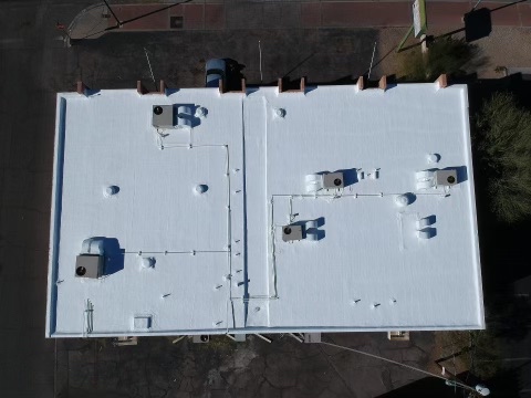 After photo showing completed commercial white roof coating system from above