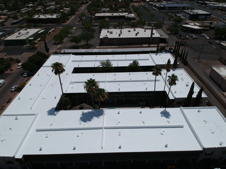 Finished commercial roof repair and reflective coating project by W&D Roofing