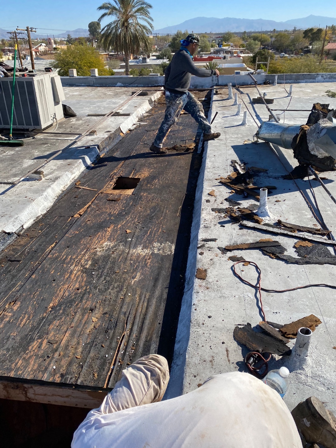 Before commercial roof tear-off showing damaged roof decking removed by W&D Roofing
