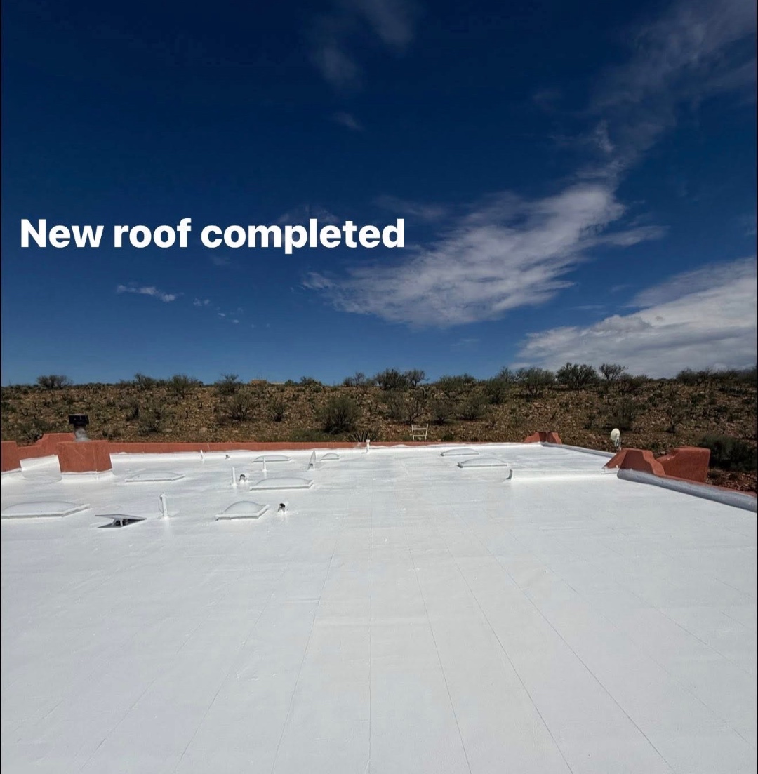 Completed W&D Roofing flat roof restoration with a reflective protective roof surface