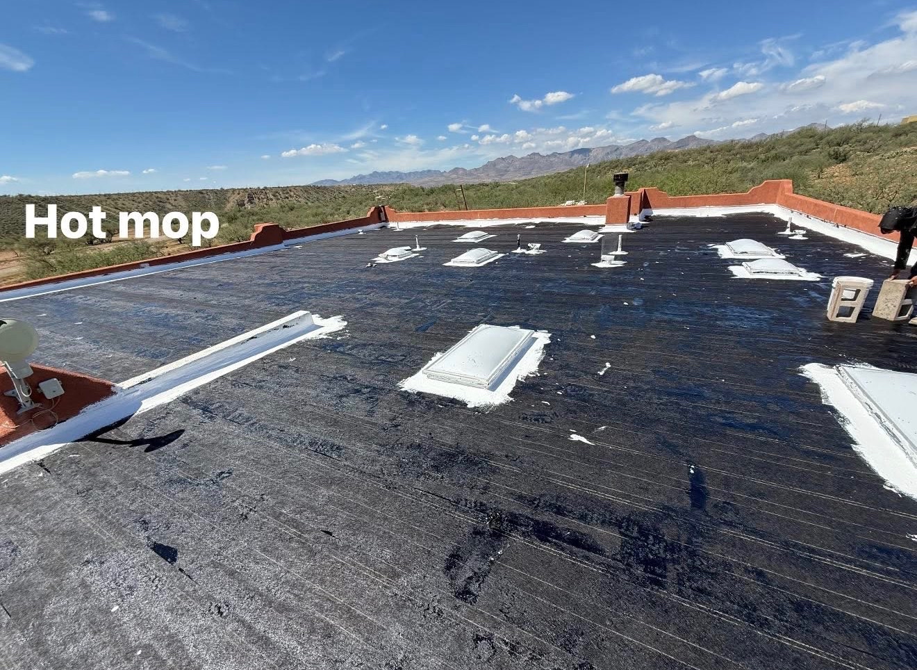 W&D Roofing built-up flat roof waterproofing system in progress on an Arizona roof