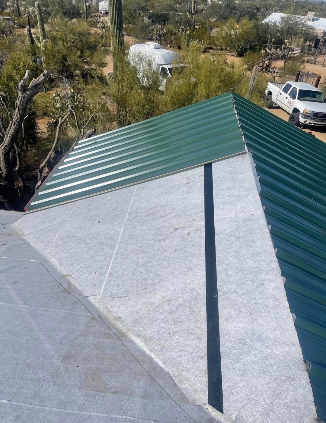 SSP metal roofing progress with underlayment and panel installation underway