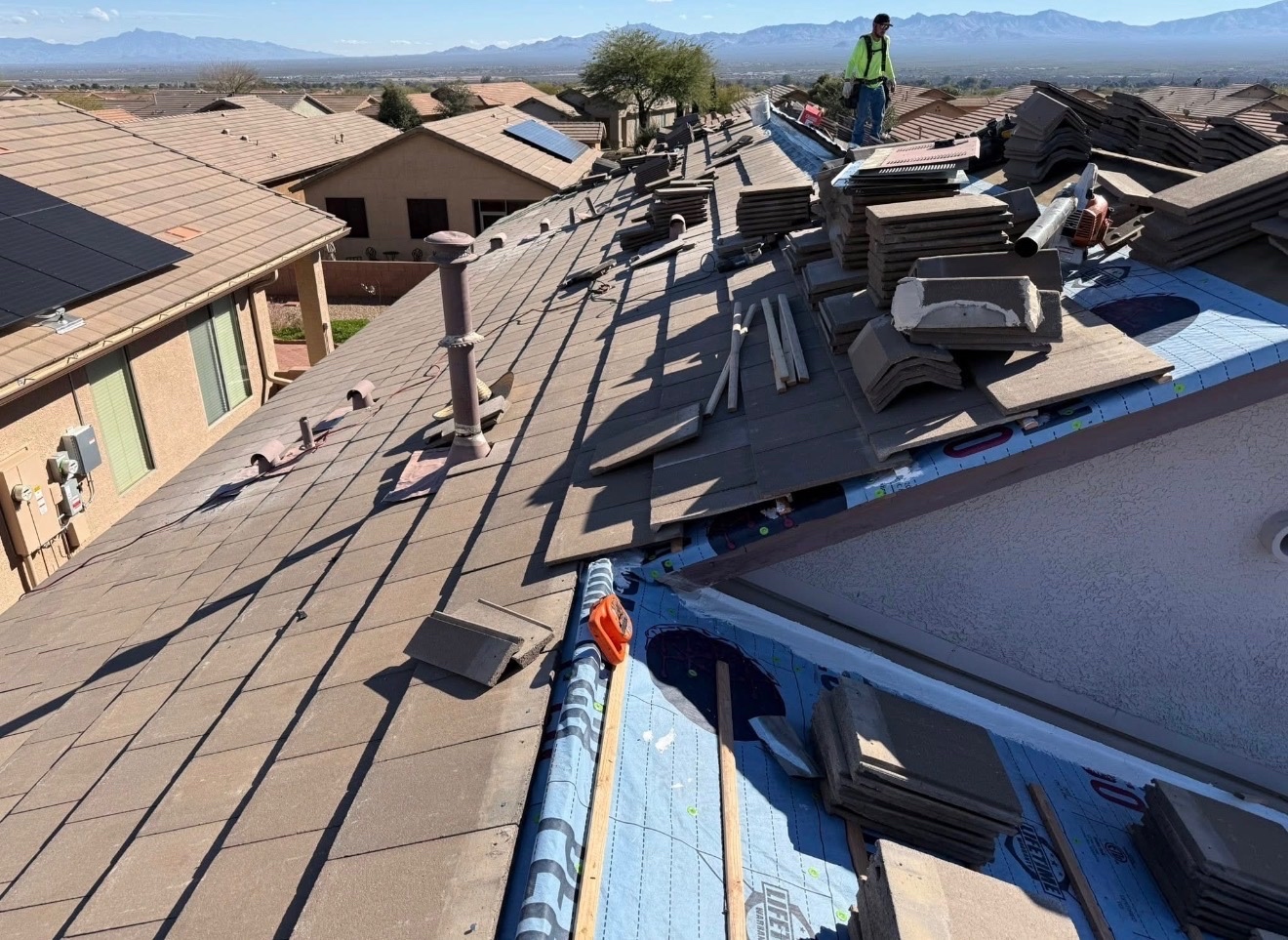 Completed W&D Roofing residential roof replacement with upgraded underlayment on an Arizona home