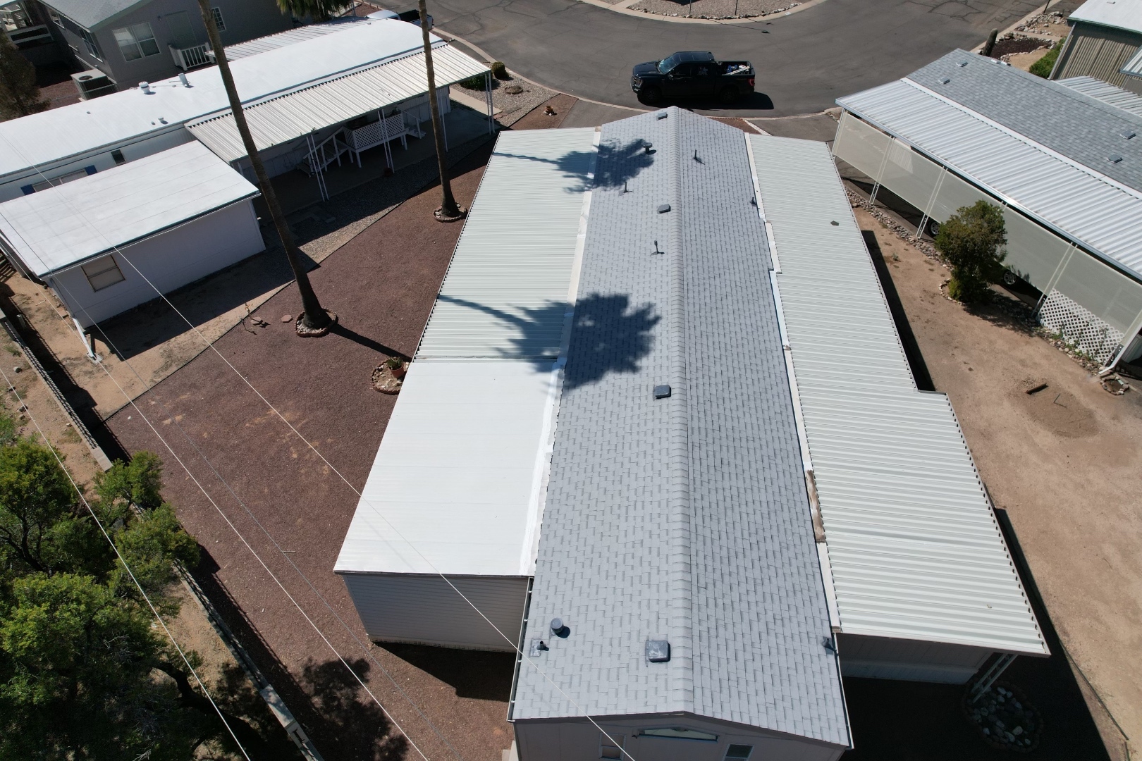 Completed W&D Roofing metal awning replacement and shingle roof replacement project