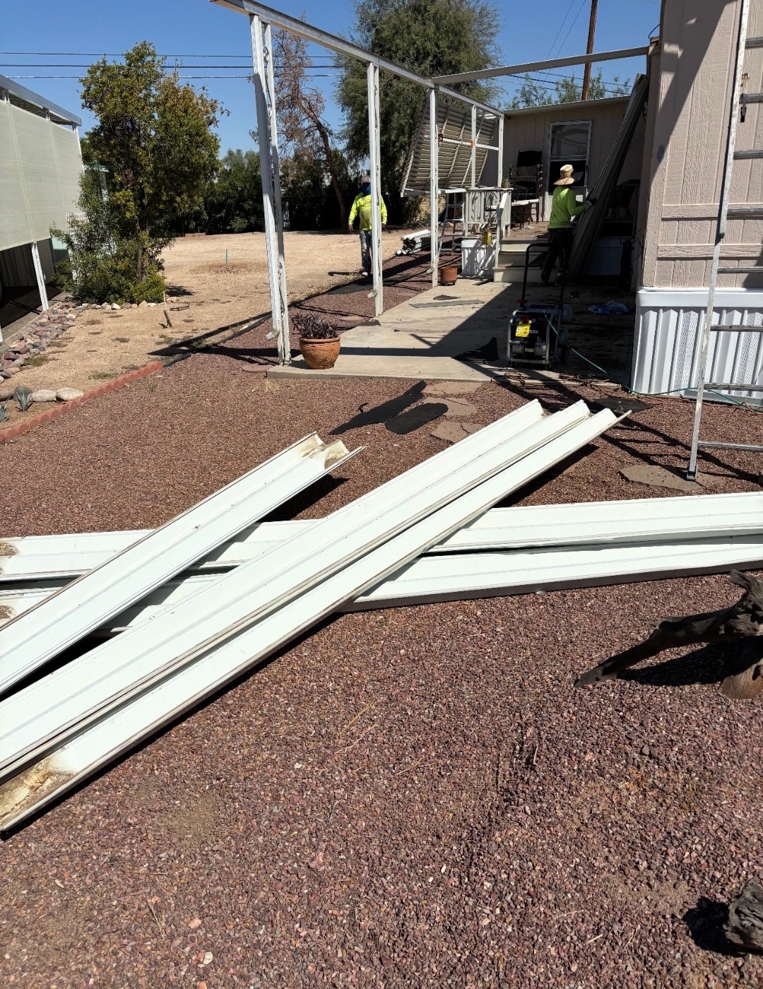 W&D Roofing metal awning and shingle roof tear-off stage