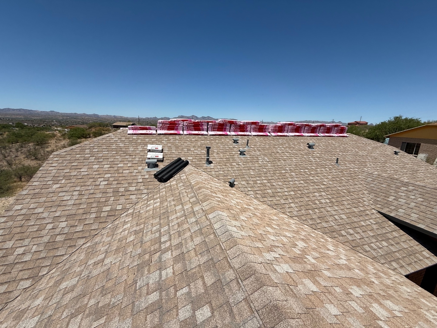 W&D Roofing shingle roof replacement materials loaded and staged at an Arizona home
