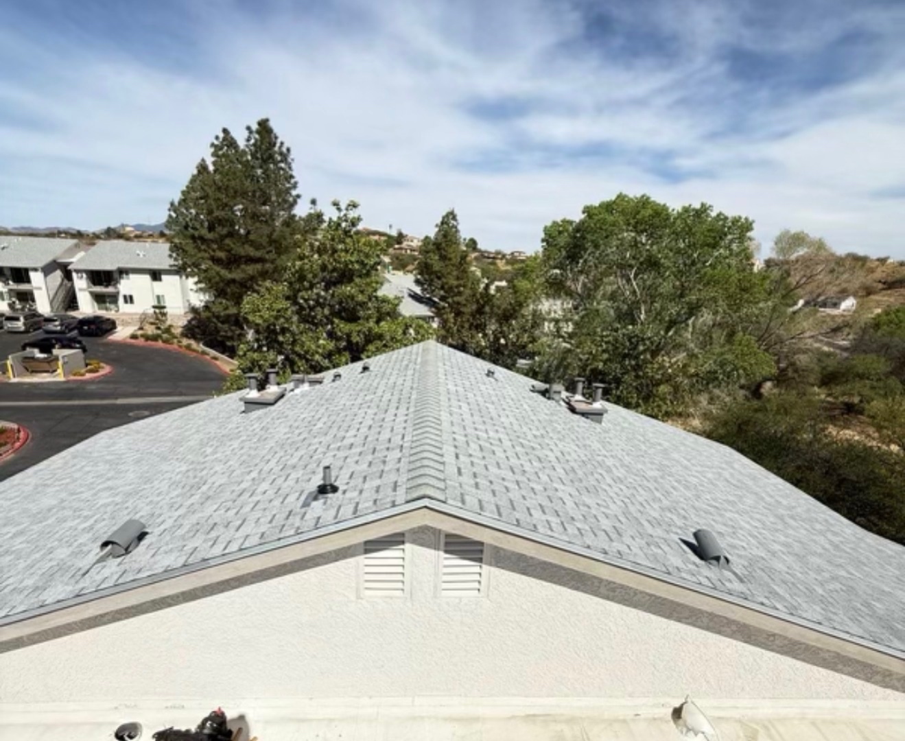 Completed W&D Roofing shingle roof replacement project with finished roof planes