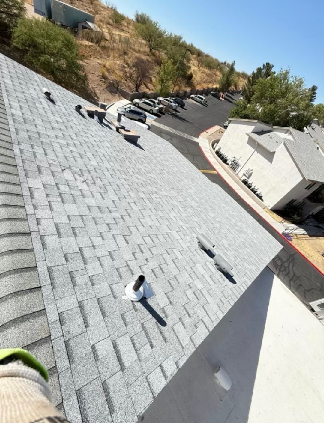 Finished W&D Roofing shingle roof completion photo from the same residential project