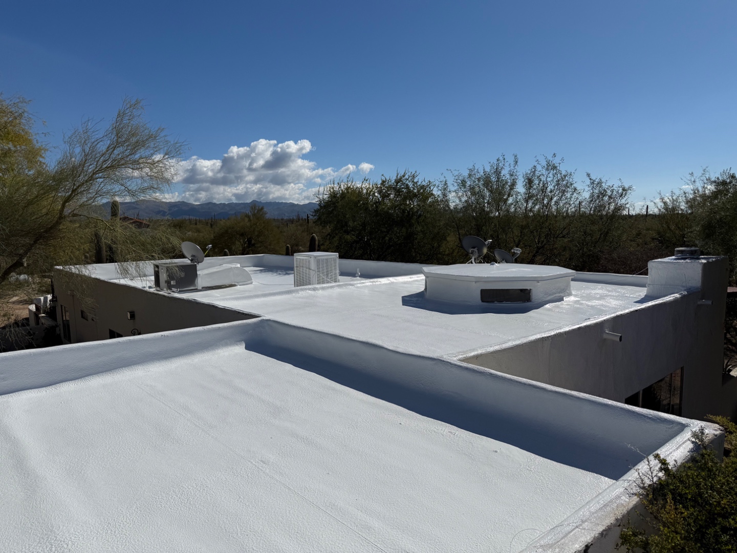 Finished Arizona flat foam roof with white reflective coating by W&D Roofing