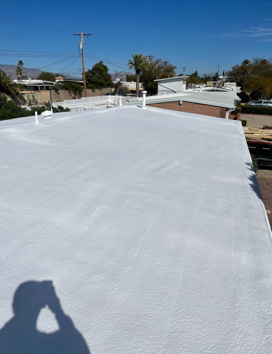 Finished W&D foam roof surface with white reflective coating