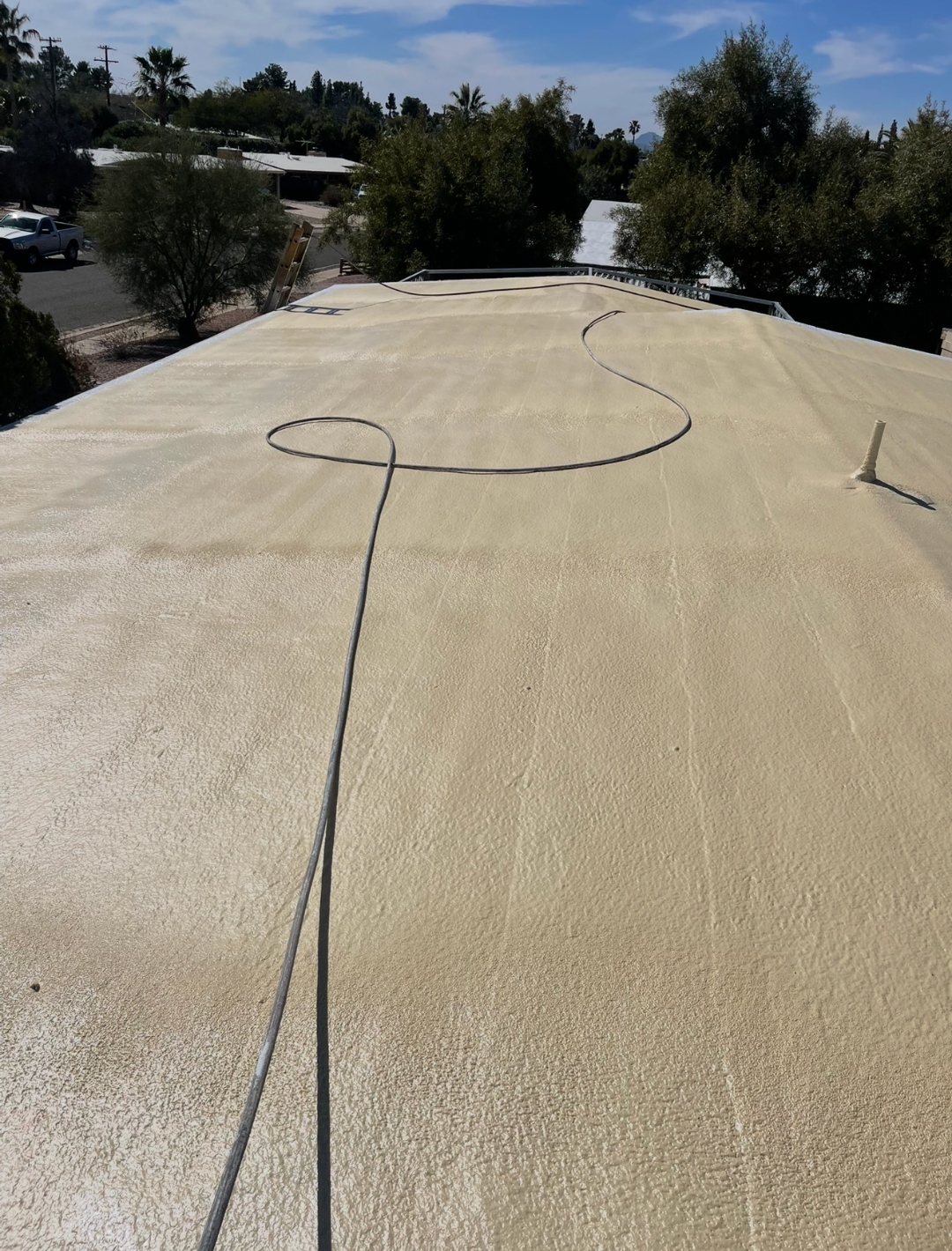 W&D spray foam roof process stage before final reflective coating