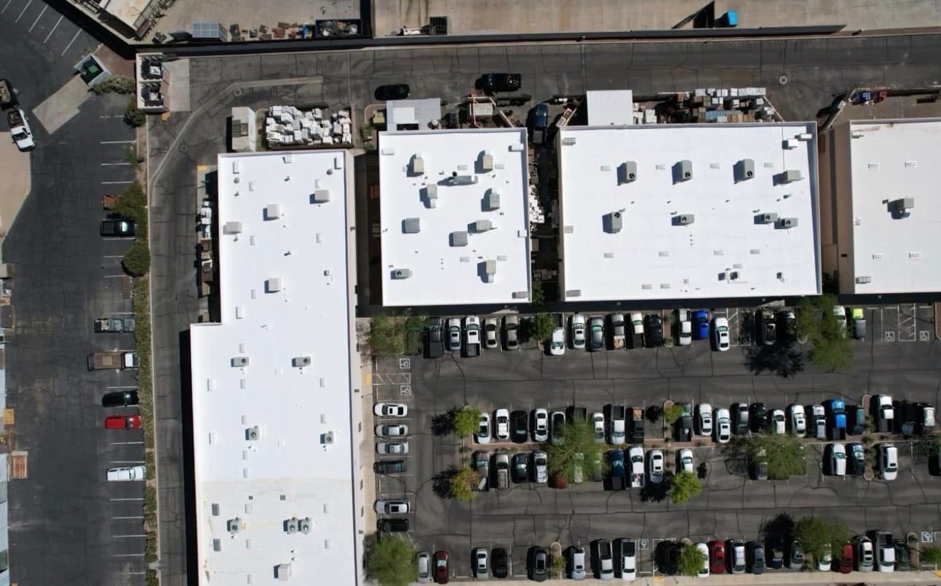 Completed W&D reflective foam roofing system on an Arizona flat roof viewed from above
