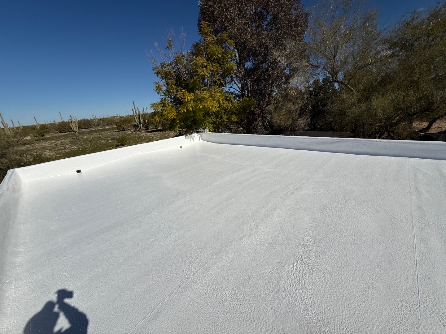 Completed W&D flat foam roof with protective reflective coating after restoration