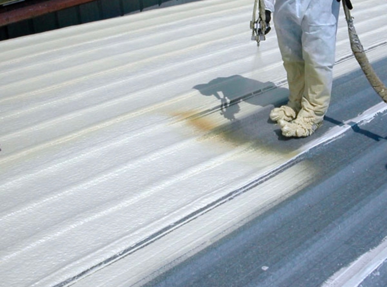 W&D reflective coating application over a flat spray foam roofing system