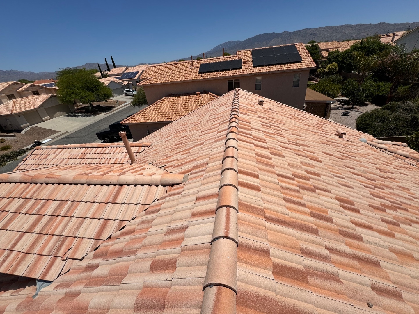 Completed W&D Roofing Arizona tile roof detail with desert mountain view
