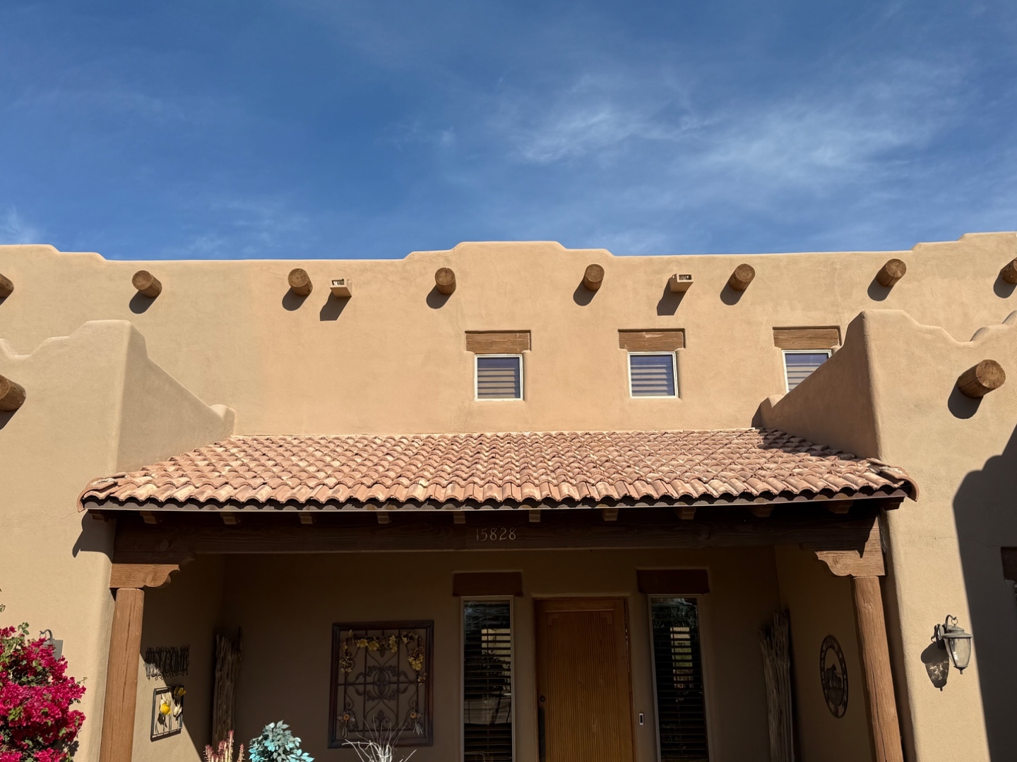 W&D Roofing Southwest tile roof project on an Arizona home beneath storm clouds