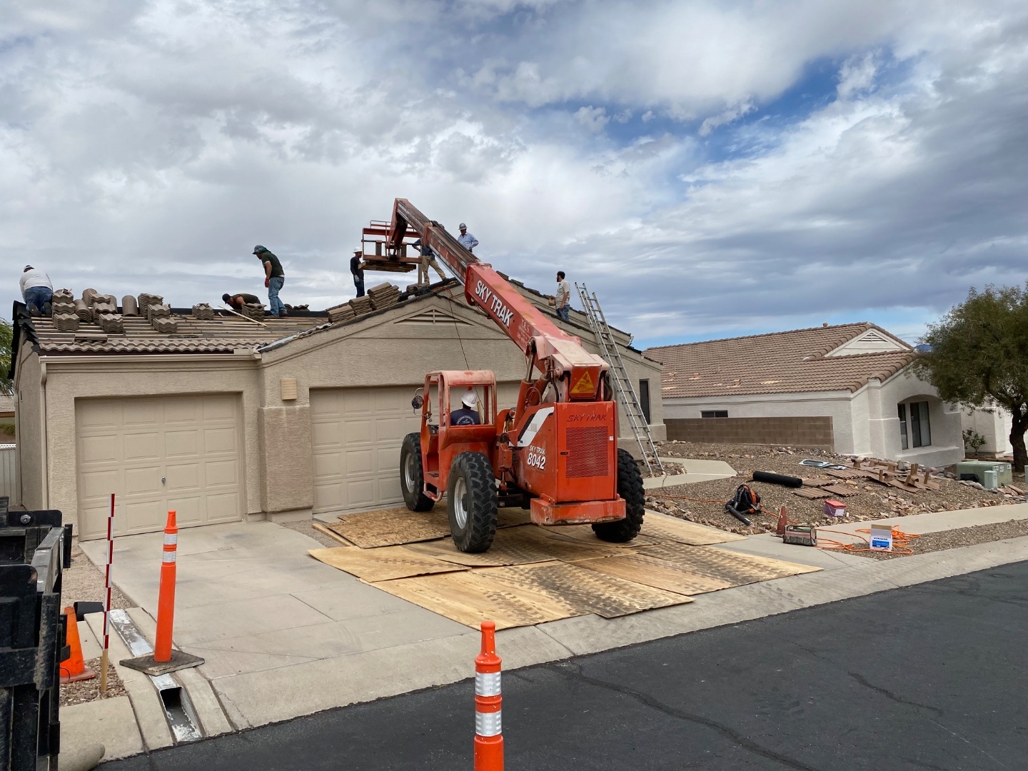 W&D Roofing tile roof replacement project with equipment at an Arizona residential property